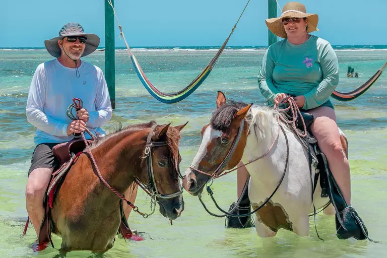 Two riders on the Horseback Riding, Snorkeling and Animal Sanctuary tour in Roatan